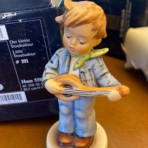 Hummel figure #101 “Little Troubadour”. Very cute.